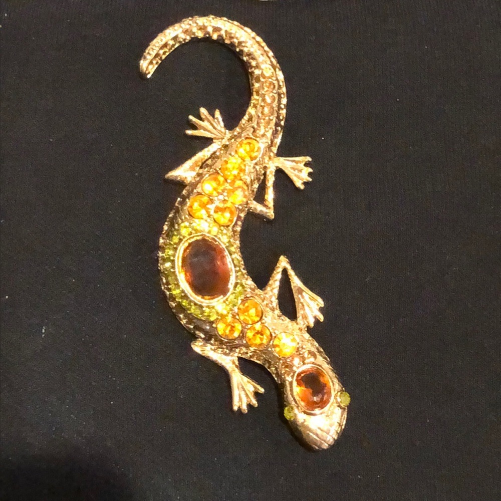 Lizard pin. Gold tone with amber colored stones